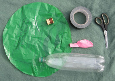 balloon, tube, duct tape, scissors, plastic sheet, and plastic drinks bottle for modelling the human ventilatiion system
